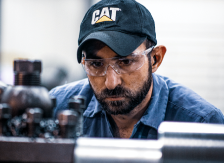 Man working on a hydraulic cylinder